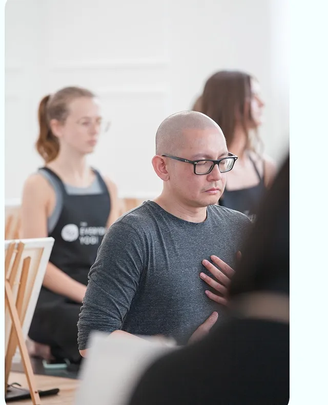 An in-person Everyday Yogi class in shared practice